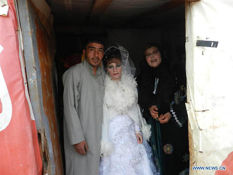 На фото: 23 февраля 2014 года в Южном регионе Сирии состоялась свадьба в лагере для беженцев. (Синьхуа)