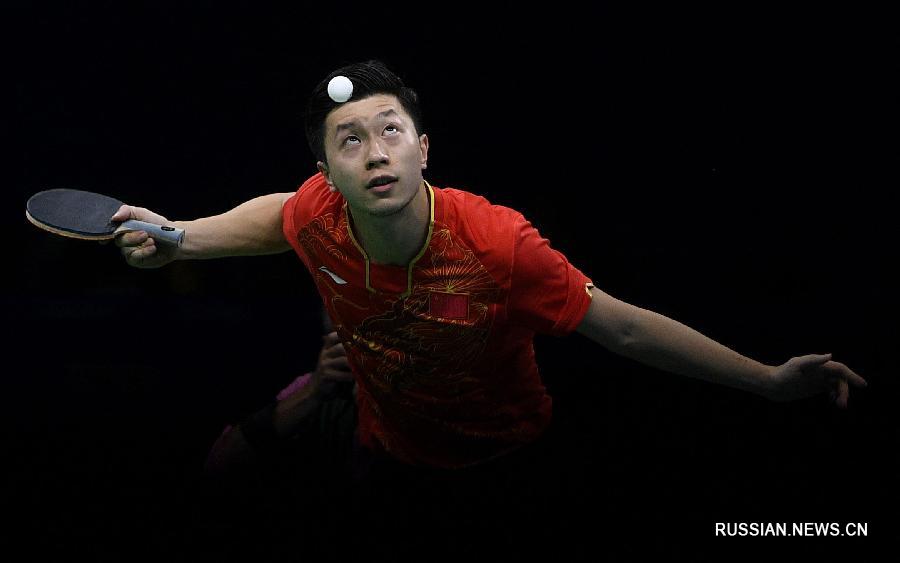 Китайские спортсмены завоевали золото Олимпиады в командном турнире по настольному теннису