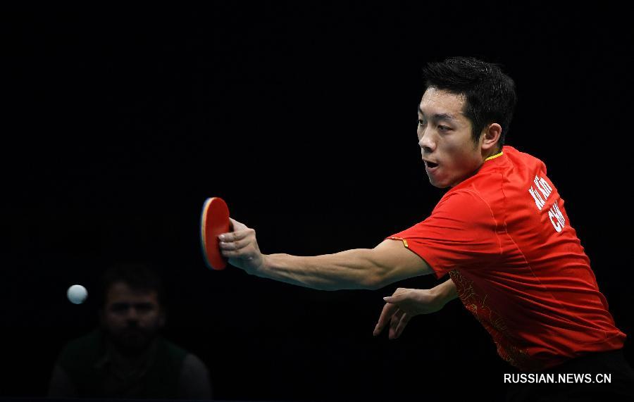 Китайские спортсмены завоевали золото Олимпиады в командном турнире по настольному теннису