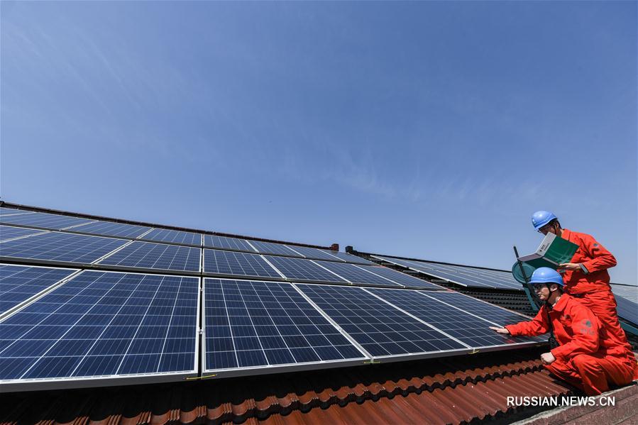 Солнечные батареи на крышах жилых домов в провинции Чжэцзян