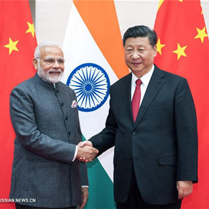 Си Цзиньпин встретился в Циндао с премьер-министром Индии Нарендрой Моди