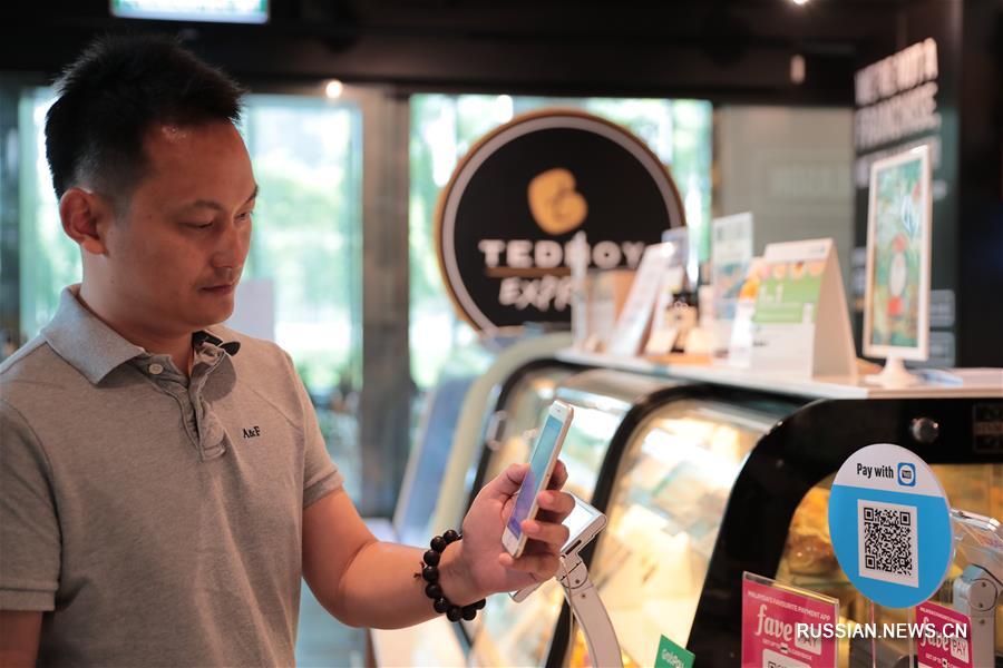 Китайские технологии помогают Малайзии расширять сферу мобильных платежей