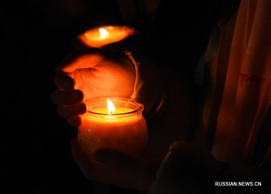 "Панихида зажженных свечей" в память о жертвах Нанкинской массовой резни 